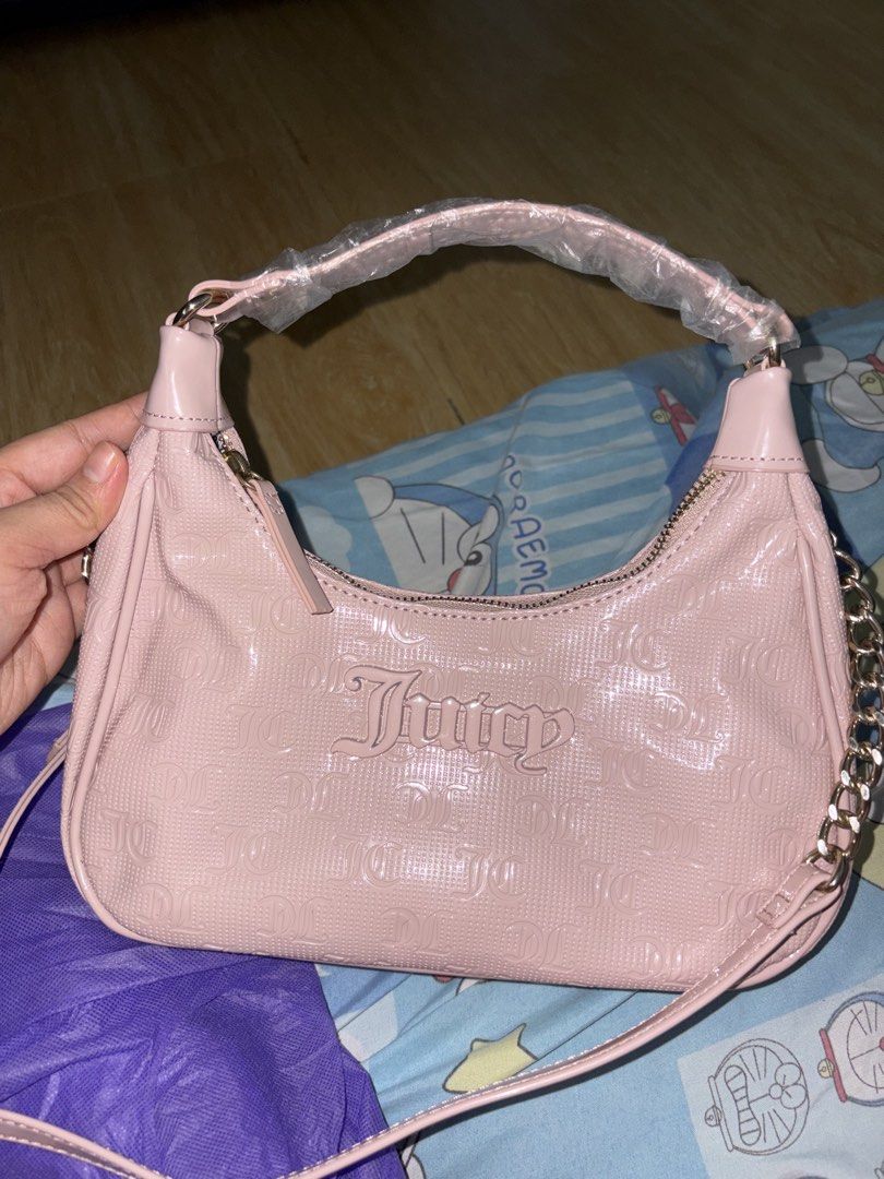 Authentic Juicy Couture semi charmed bag (Category: Cross-body Bags) located in Malolos. Submitted by keithkat11 (Listing ID 1460886256, Image 1). Description: 💗juicy couture semi charmed hobo bag💗 -Brand new, only removed the tags. Reason for selling: I didn't realize it was not my style🥲.