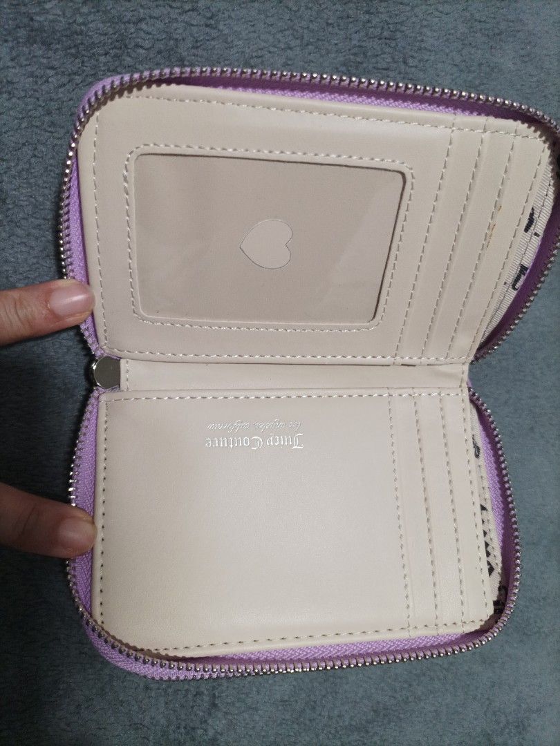 Juicy Couture Velour Wallet Pouch Lavender (Category: Wallets & Card holders) located in Las Pinas. Submitted by bloomandchapters (Listing ID 1460842072, Image 3). Description: - Cute lavender Juicy Couture wallet - Soft velour material - Sparkly 'Juicy' logo on the front - Secure zipper closure - Interior features card slots and a clear ID window - Signature Juicy Couture logo pattern lining - Adorable small charm attached to the zipper.