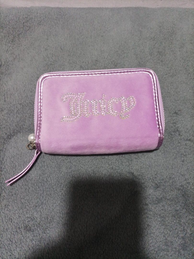 Juicy Couture Velour Wallet Pouch Lavender (Category: Wallets & Card holders) located in Las Pinas. Submitted by bloomandchapters (Listing ID 1460842072, Image 1). Description: - Cute lavender Juicy Couture wallet - Soft velour material - Sparkly 'Juicy' logo on the front - Secure zipper closure - Interior features card slots and a clear ID window - Signature Juicy Couture logo pattern lining - Adorable small charm attached to the zipper.