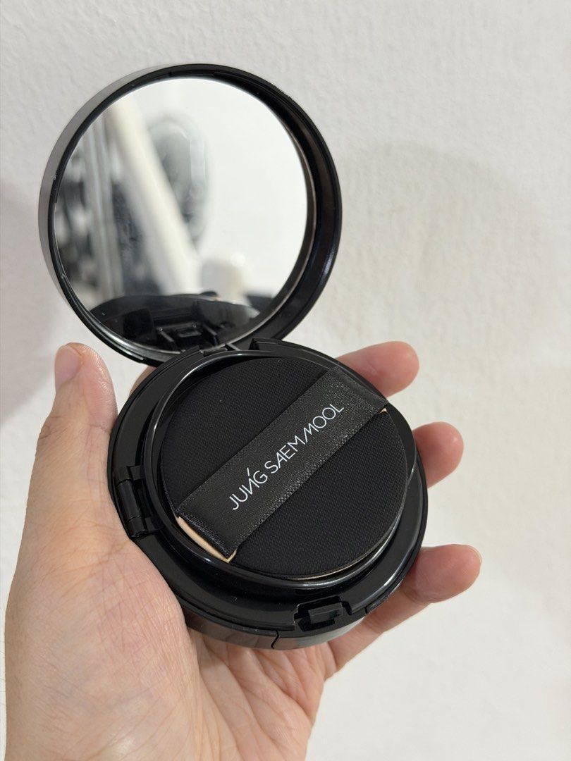 JUNG SAEM MOOL Cushion Foundation Compact (Category: Makeup) located in Paranaque City. Submitted by khamsay (Listing ID 1460802252, Image 2). Description: - JUNG SAEM MOOL cushion foundation compact - Sleek black case with built-in mirror - Includes original puff - Cushion is pre-filled with product - Ideal for quick touch-ups and easy portability Like new. Swatched once only. Rfs: not my shade match.