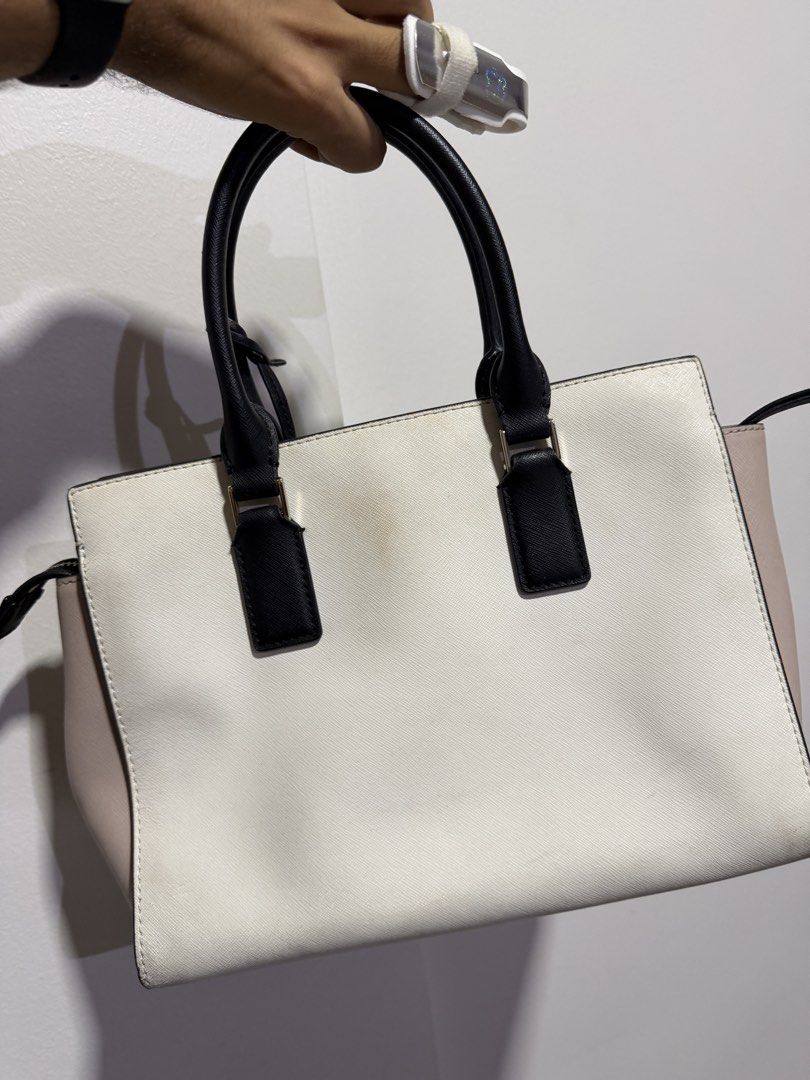 Kate Spade New York Tote Bag (Category: Tote Bags) located in Paranaque City. Submitted by captainthanos01 (Listing ID 1460832035, Image 2). Description: - Kate Spade tote bag - Color blocking: Black, white, and pale pink - Versatile carrying options: Top handles and detachable crossbody strap - Organized interior: Multiple compartments and a zip pocket - Ideal for everyday use.
