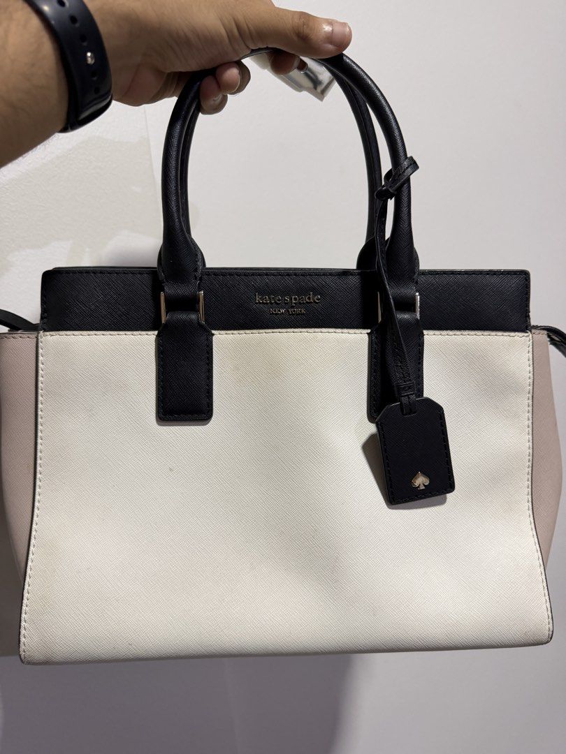 Kate Spade New York Tote Bag (Category: Tote Bags) located in Paranaque City. Submitted by captainthanos01 (Listing ID 1460832035, Image 1). Description: - Kate Spade tote bag - Color blocking: Black, white, and pale pink - Versatile carrying options: Top handles and detachable crossbody strap - Organized interior: Multiple compartments and a zip pocket - Ideal for everyday use.