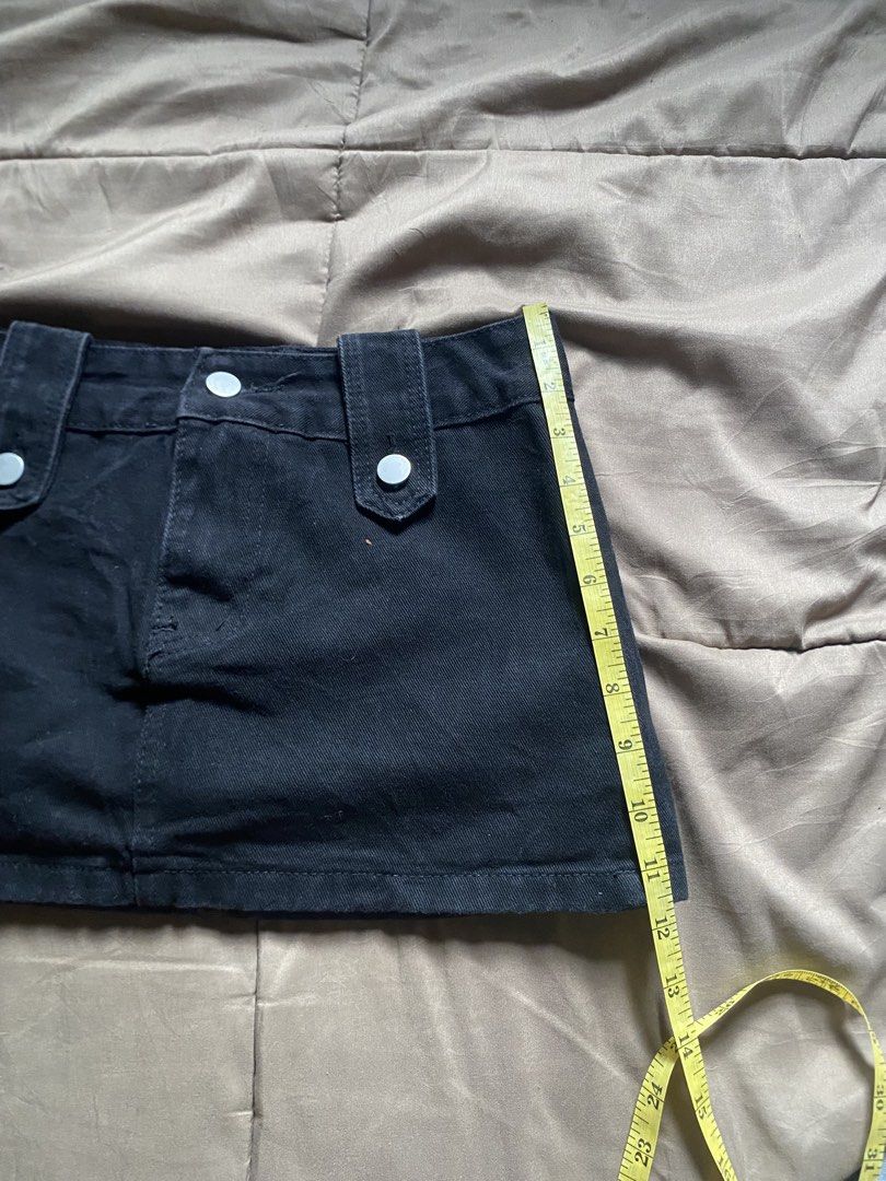 Kendall Black Denim Mini Skirt (Category: Skirts) located in Caloocan City. Submitted by lienzonius (Listing ID 1460727577, Image 2). Description: - Classic black denim mini skirt - Two front pockets and two back pockets - Belt loops at the waist - Button and zip closure - Approx. 13 inches in length - Approx. 28 inches in waist - Ideal for casual wear.
