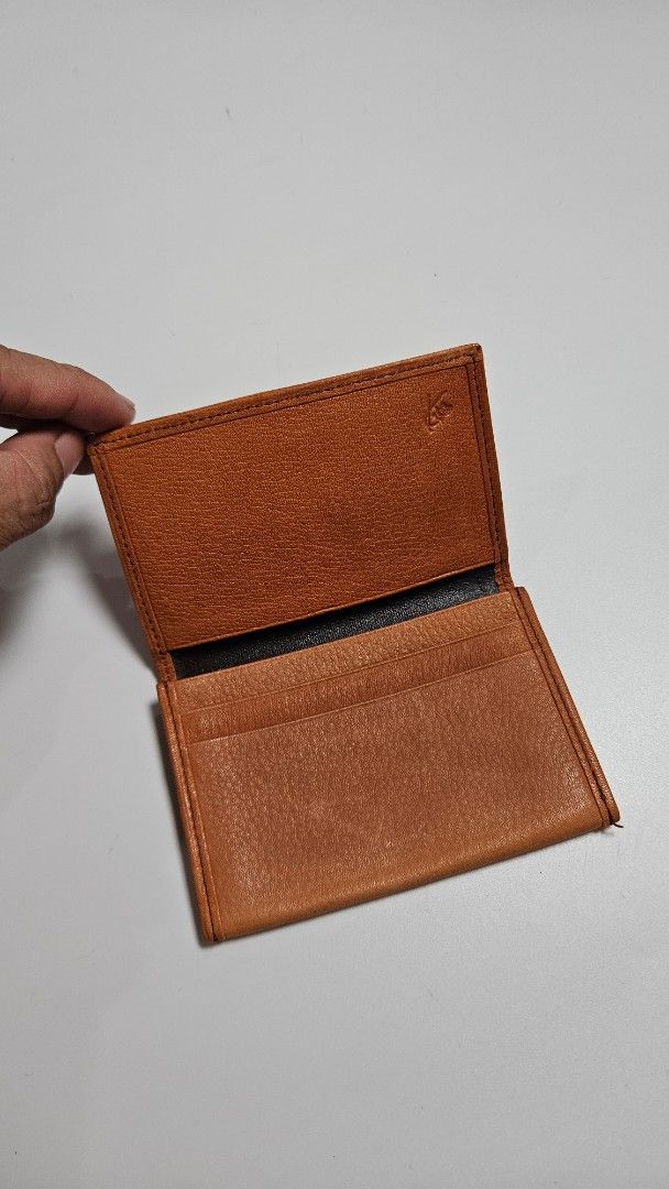 KENZO Brown Leather Bifold Wallet (Category: Luxury Bags & Wallets) located in Alfonso. Submitted by jbcamet (Listing ID 1460828383, Image 3). Description: - Brand: KENZO - Material: Brown Leather - Exterior: Textured with embossed logo - Interior: Card slots - Style: Classic bifold, perfect for everyday use.
