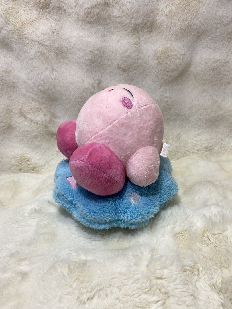 Kirby Plush Toy on Blue Cloud (Category: Plushies & Soft Toys) located in Kalibo. Submitted by ollie_stuffshop (Listing ID 1460865738, Image 3). Description: 19cm x 21cm Before you send your inquiries: ❗️Last Price is already posted ❗️Manage your expectations, WYSIWYG ❗️May need washing ❗️Dropoff is every Wednesday & Sunday - Adorable Kirby plush sitting on a fluffy blue cloud. - Made with soft and squishy material for ultimate comfort. - A must-