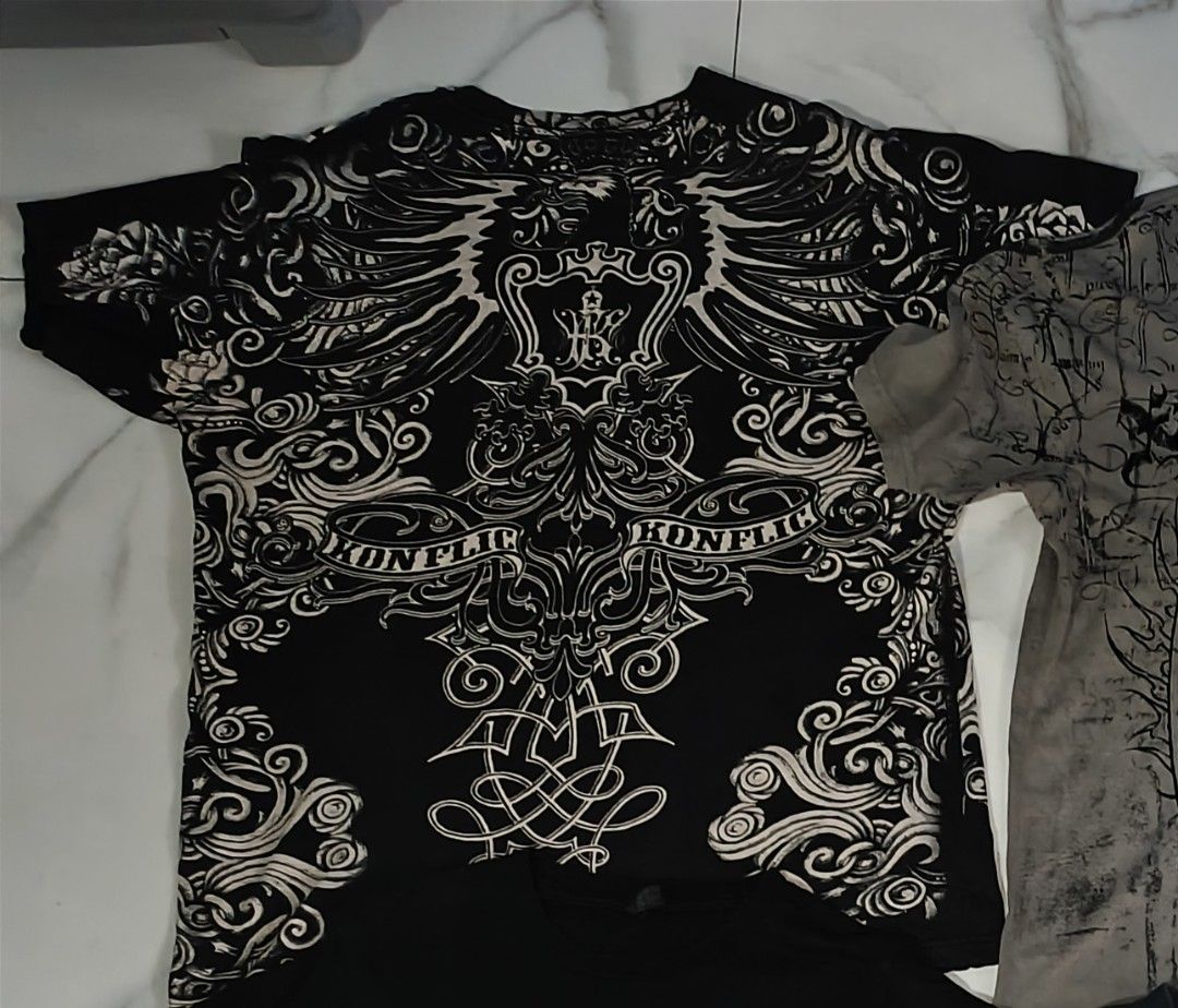 Konflic AOP Tee (Category: Tshirts & Polo Shirts ) located in Bacolod City. Submitted by decayed_outlet (Listing ID 1460756183, Image 1). Description: 100% Cotton 22x30 Condition : 9.5 Color : Black/White Color rate : 9.8 Issue : one scratch on shoulder part (Not serious).