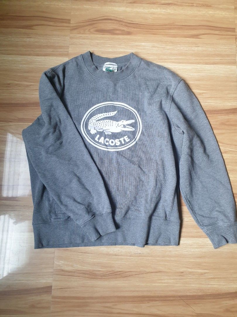 Lacoste gray crewneck sweater original (Category: Coats, Jackets and Outerwear) located in Paranaque City. Submitted by nvdluxurygoods (Listing ID 1460729987, Image 1). Description: unisex for men and womem no issue, no flaws, authentic guaranteed gray to medium dark gray color -ready to ship♡ Lacoste crewneck sweatshirt featuring an oversized circular 3D crocodile logo on the chest Size: L Price: 3,500 (negotiable♡).