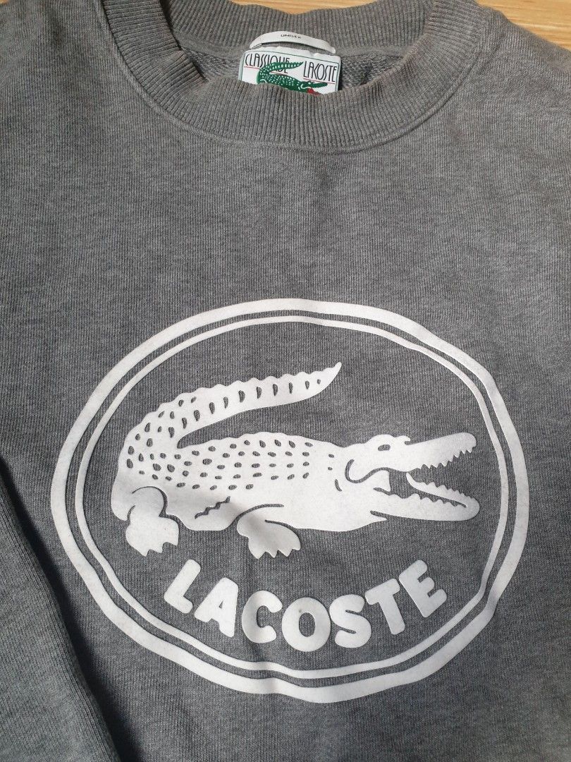 Lacoste gray crewneck sweater original (Category: Coats, Jackets and Outerwear) located in Paranaque City. Submitted by nvdluxurygoods (Listing ID 1460729987, Image 3). Description: unisex for men and womem no issue, no flaws, authentic guaranteed gray to medium dark gray color -ready to ship♡ Lacoste crewneck sweatshirt featuring an oversized circular 3D crocodile logo on the chest Size: L Price: 3,500 (negotiable♡).