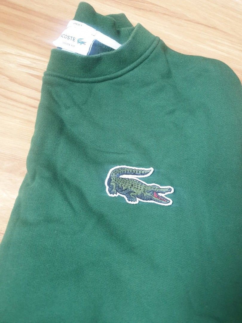 Lacoste green crewneck sweatshirt (Category: Coats, Jackets and Outerwear) located in Paranaque City. Submitted by nvdluxurygoods (Listing ID 1460767049, Image 2). Description: Fors sale: Authentic green Lacoste crewneck sweatshirt -Unisex for men and women -No flaws, no issue, authentic guaranteed. -♡selling price Color may vary due to lighting, actual color is dark green..