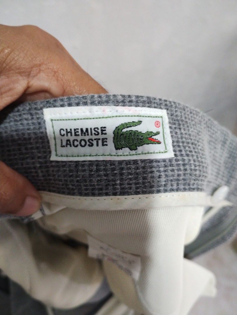 Lacoste Grey Houndstooth Tailored Trousers (Category: Trousers) located in Imus. Submitted by darylg88358770 (Listing ID 1460736158, Image 3). Description: - Brand: Lacoste - Color: Grey - Pattern: Houndstooth - Fit: Classic Tailored - Closure: Button and Zip - Pockets: Two back pockets - Material: Polyester - Size: 88 - Occasion: Smart Casual or Formal Wear - Condition: Please check photos for details the items trifted fresh from bale need wash 