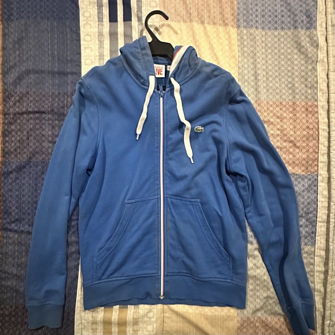 Lacoste Live Blue Zip-Up Hoodie (Category: Hoodies) located in Muntinlupa City. Submitted by ilovedogs727 (Listing ID 1460871532, Image 1). Description: - Blue Lacoste Live zip-up hoodie - Classic crocodile logo on chest - Two front pockets - Drawstring hood - Ideal for casual wear - Pairs well with jeans or shorts - 21 x 23 inches.