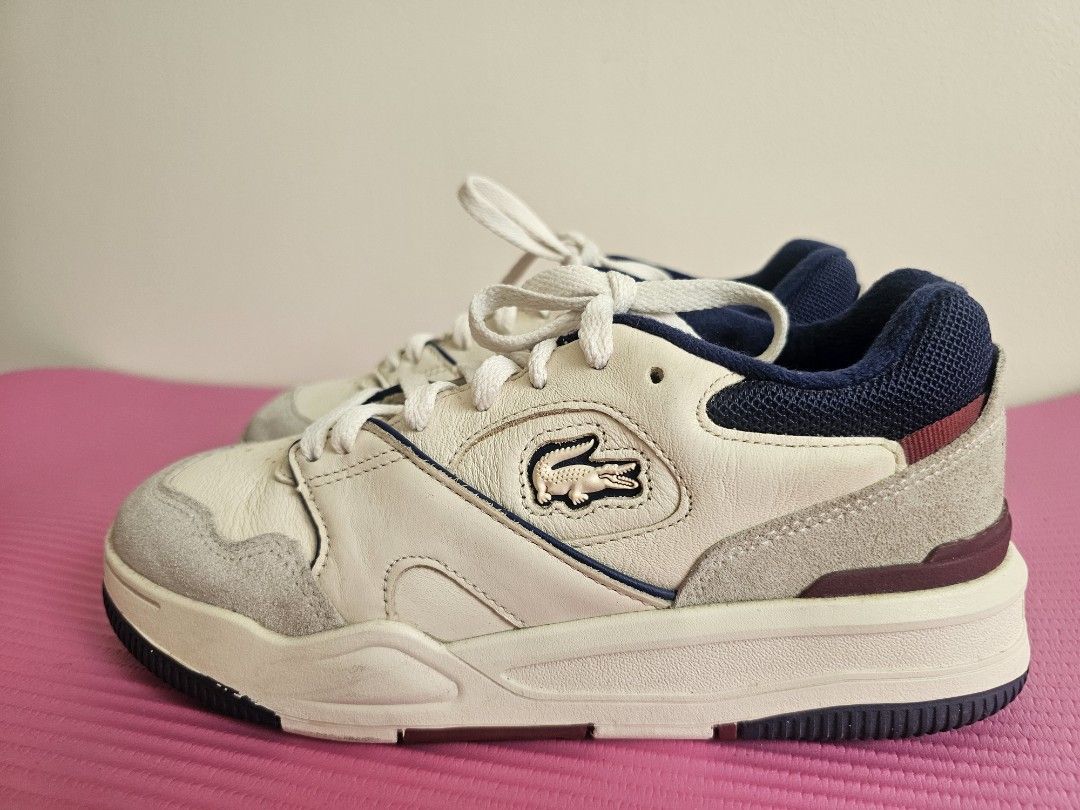 Lacoste White Leather Sneakers with Navy Accents (Category: Sneakers) located in Manila. Submitted by czarinajadeee (Listing ID 1460723629, Image 1). Description: - Brand: Lacoste - Color: White - Accents: Navy blue collar & heel, grey suede toe & sides - Style: Classic lace-up - Perfect for: Casual wear.
