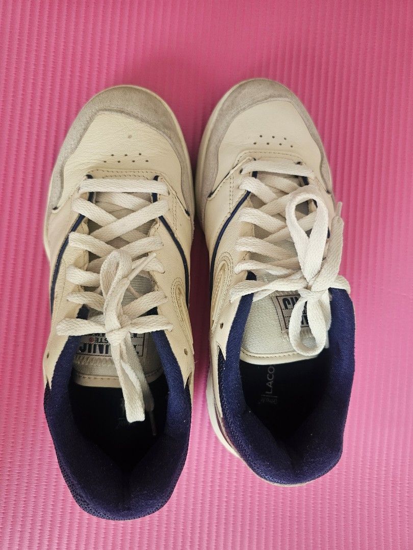 Lacoste White Leather Sneakers with Navy Accents (Category: Sneakers) located in Manila. Submitted by czarinajadeee (Listing ID 1460723629, Image 2). Description: - Brand: Lacoste - Color: White - Accents: Navy blue collar & heel, grey suede toe & sides - Style: Classic lace-up - Perfect for: Casual wear.