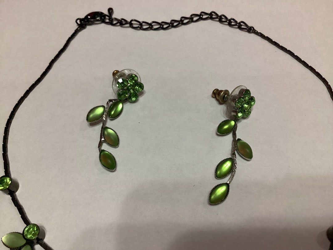 Leaf & Floral Design Necklace & Earrings (Category: Necklaces) located in Davao. Submitted by ferdipt (Listing ID 1460737438, Image 2). Description: Jewelry set featuring a leaf and floral design with green rhinestones and metallic leaves..