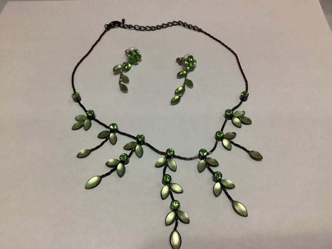 Leaf & Floral Design Necklace & Earrings (Category: Necklaces) located in Davao. Submitted by ferdipt (Listing ID 1460737438, Image 1). Description: Jewelry set featuring a leaf and floral design with green rhinestones and metallic leaves..