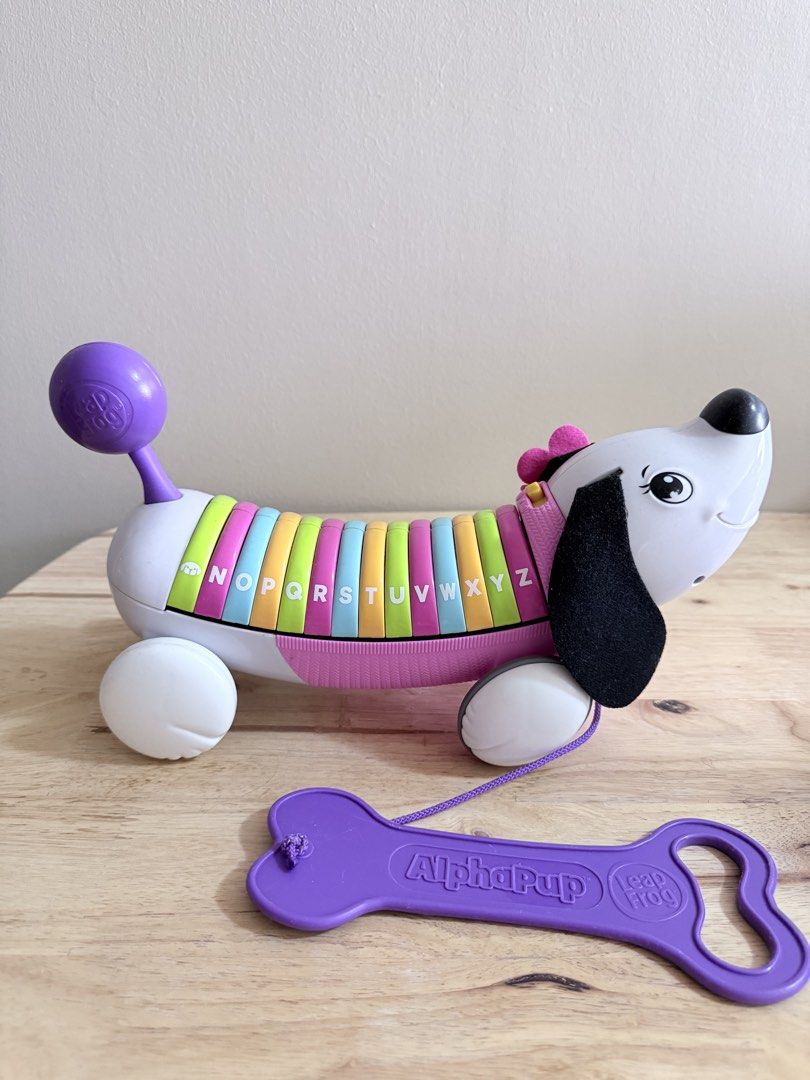 LeapFrog AlphaPup Pull Toy ABCs Learning Dog (Category: Educational & Learning Toys) located in San Juan City. Submitted by nadine.chavez (Listing ID 1460778763, Image 2). Description: - LeapFrog AlphaPup pull toy - Features letters A-Z on its back - Press letters to hear them and learn words - Includes pull string and bone-shaped tag - Ideal for early alphabet recognition and learning.