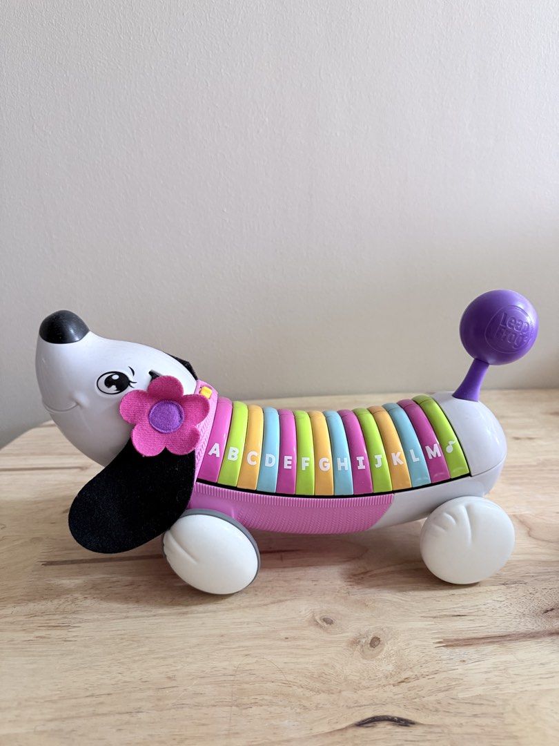 LeapFrog AlphaPup Pull Toy ABCs Learning Dog (Category: Educational & Learning Toys) located in San Juan City. Submitted by nadine.chavez (Listing ID 1460778763, Image 1). Description: - LeapFrog AlphaPup pull toy - Features letters A-Z on its back - Press letters to hear them and learn words - Includes pull string and bone-shaped tag - Ideal for early alphabet recognition and learning.