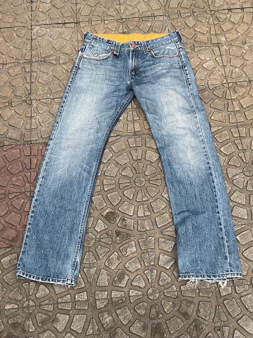 Levi's 501 Jeans Blue Denim Bootcut (Category: Jeans) located in Mabalacat. Submitted by epicforest_78284 (Listing ID 1460787555, Image 2). Description: - Classic Levi's 501 jeans - Blue denim - Bootcut leg - Fading and distressing for a worn-in look - Frayed hem - Button fly closure - Ideal for everyday wear.