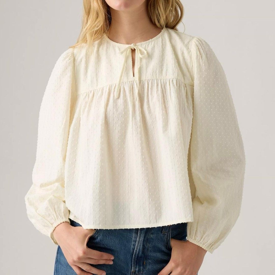 Levi's Josephine Long Sleeve White Top (Category: Blouses) located in Pasig City. Submitted by brownbagph (Listing ID 1460887537, Image 2). Description: Product Features: Approx. 22" long Notched V-neck Long sleeves Cotton, viscose, Lurex.