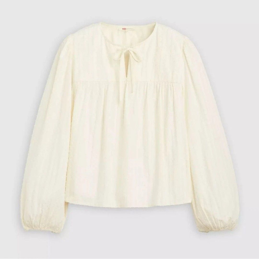 Levi's Josephine Long Sleeve White Top (Category: Blouses) located in Pasig City. Submitted by brownbagph (Listing ID 1460887537, Image 1). Description: Product Features: Approx. 22" long Notched V-neck Long sleeves Cotton, viscose, Lurex.