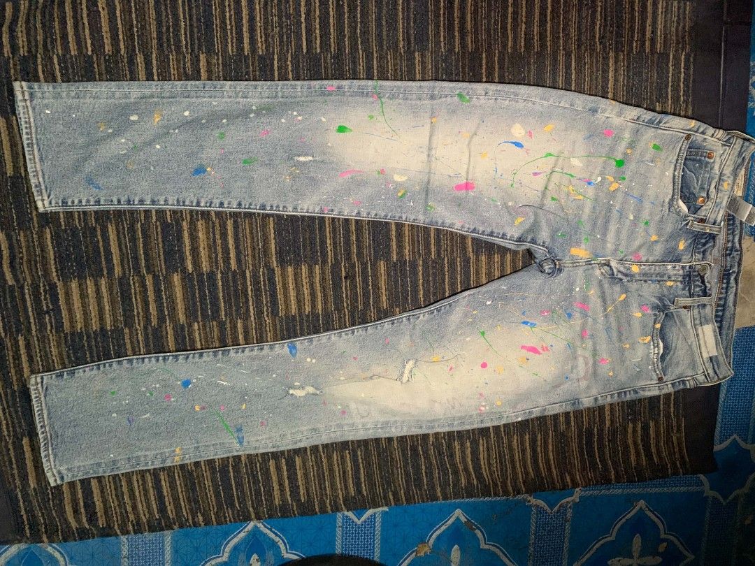Levi's Premium Jeans - Paint Splatter Design (Category: Jeans) located in Manila. Submitted by itsyourboymat (Listing ID 1460739921, Image 2). Description: - Brand: Levi's Premium selvedge - Size: W32 L34 - Style: Straight Leg - Wash: Light Wash Denim - Design: Unique paint splatter (blue, yellow, pink, green) - Feature: Statement piece for your wardrobe.