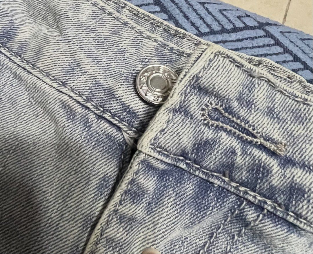 Light Wash Distressed Baggy Jeans (Category: Jeans) located in Surigao. Submitted by boonz71_1971 (Listing ID 1460888145, Image 3). Description: “Closet clean-out - PluS SiZe” - Waist 40” Length 40” - Light wash baggy jeans - Distressed details with rips and tears - Button fly closure - Waist: approx. 36 inches - Inseam: approx. 30 inches - Perfect for a casual streetwear style.