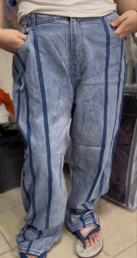 Light Wash Striped Denim Jeans (Category: Jeans) located in Surigao. Submitted by boonz71_1971 (Listing ID 1460882945, Image 1). Description: “Closet Declutter Sale - for PLus SiZe women” - Width 38” Length 41” - Light wash denim jeans - Features dark blue vertical stripes - Relaxed fit for everyday comfort - Includes front and back pockets - Zipper and button closure - Measurements available in photos - Ideal for your casual wardrobe.