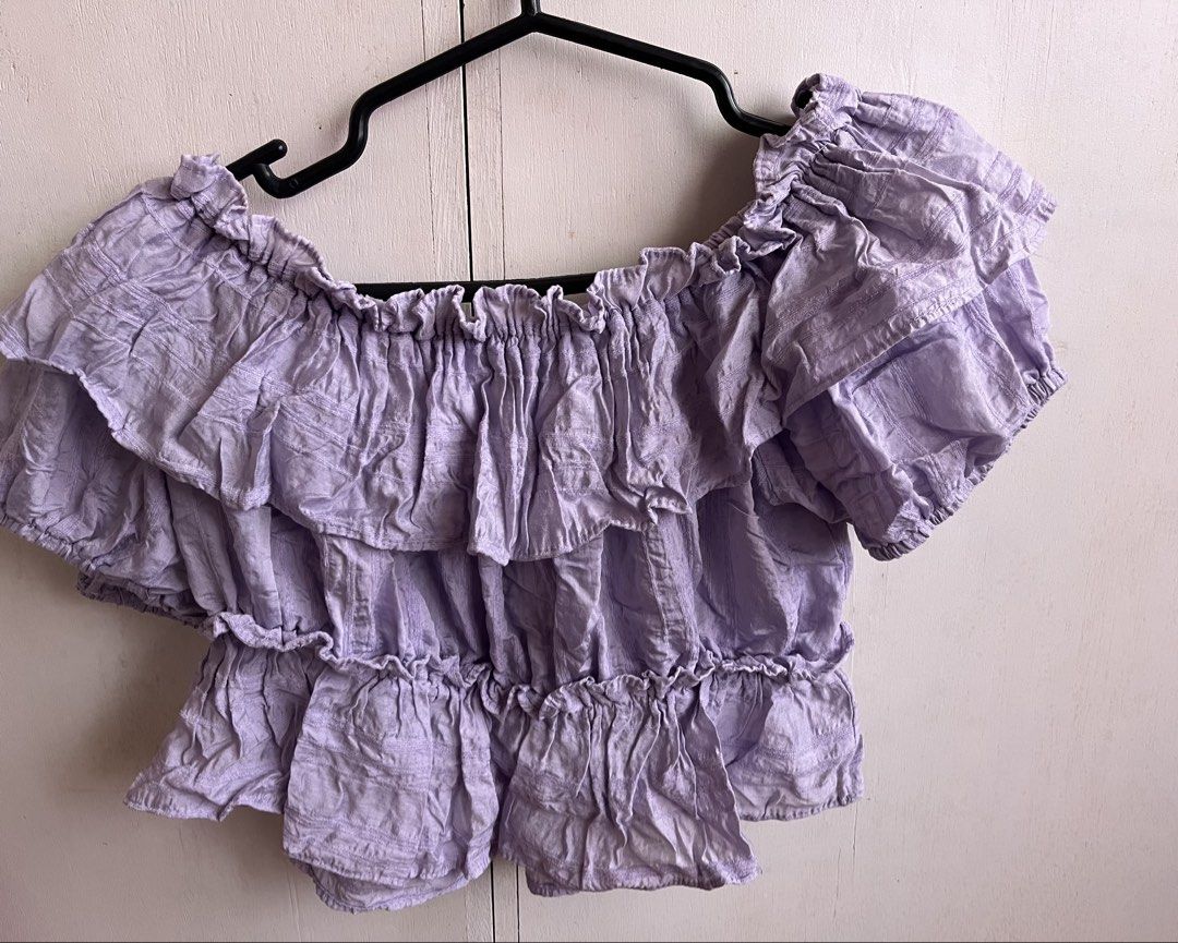 Lilac Off-Shoulder Ruffle Crop Top (Category: Blouses) located in Manila. Submitted by cosmicwhale.54b057 (Listing ID 1460745724, Image 1). Description: size small to medium never been worn loc: pampanga mod: jnt.