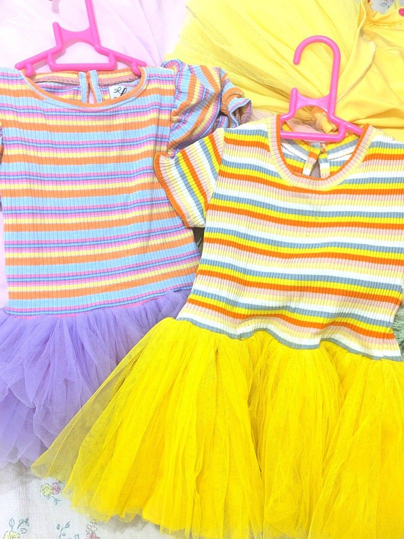 Little Elia Striped Tulle Dresses (Category: Babies & Kids Fashion) located in Quezon City. Submitted by lovedvintage0801 (Listing ID 1460745541, Image 3). Description: - Two adorable Little Elia striped dresses - Available with lavender or yellow tulle skirt - Features short puff sleeves and ribbed knit top - Button closure at the back for easy dressing - Perfect for parties or comfortable everyday wear - Super cute and comfy for little ones.