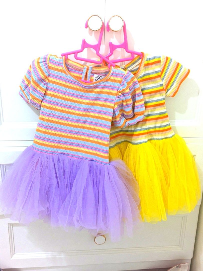 Little Elia Striped Tulle Dresses (Category: Babies & Kids Fashion) located in Quezon City. Submitted by lovedvintage0801 (Listing ID 1460745541, Image 1). Description: - Two adorable Little Elia striped dresses - Available with lavender or yellow tulle skirt - Features short puff sleeves and ribbed knit top - Button closure at the back for easy dressing - Perfect for parties or comfortable everyday wear - Super cute and comfy for little ones.