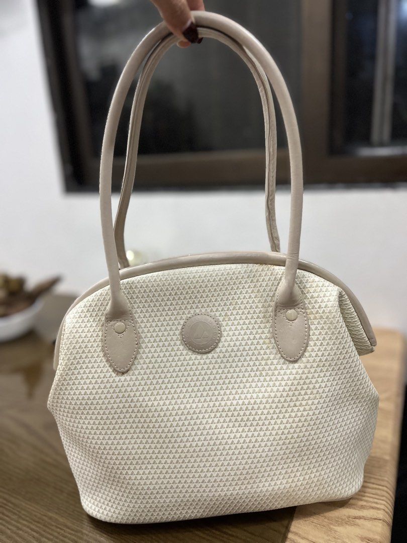 Liz Claiborne Beige Monogram Shoulder Bag (Category: Shoulder Bags) located in Quezon City. Submitted by happyshop31 (Listing ID 1460726773, Image 1). Description: - Classic beige shoulder bag by Liz Claiborne - Features signature all-over monogram pattern - Genuine leather trim and handles - Interior zip pocket for essentials - Made in Korea - Ideal everyday bag.