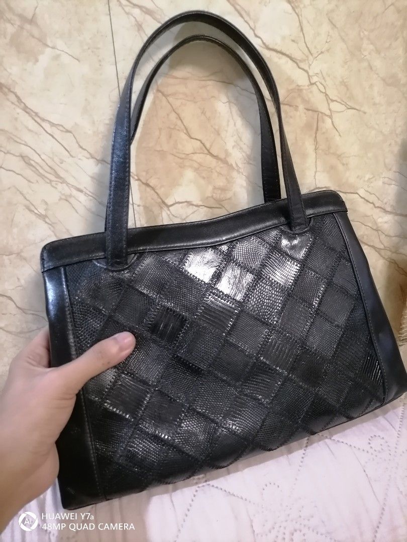 Lizard Skin Black Patchwork Leather Tote Bag (Category: Tote Bags) located in Naga. Submitted by mrwisethrifter (Listing ID 1460820064, Image 1). Description: - Classic black leather tote bag - Unique patchwork design on the front - Two comfortable top handles - Spacious interior for all your essentials - Versatile for everyday use or evening outings - A timeless accessory to elevate any outfit.