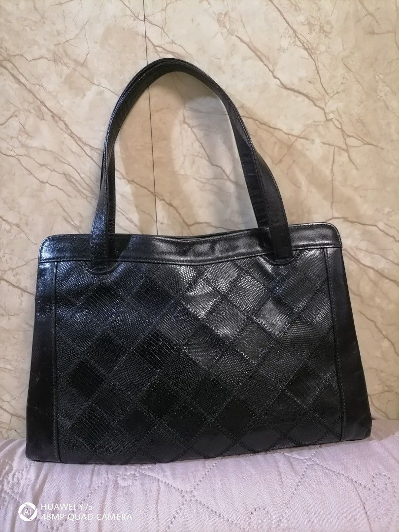 Lizard Skin Black Patchwork Leather Tote Bag (Category: Tote Bags) located in Naga. Submitted by mrwisethrifter (Listing ID 1460820064, Image 2). Description: - Classic black leather tote bag - Unique patchwork design on the front - Two comfortable top handles - Spacious interior for all your essentials - Versatile for everyday use or evening outings - A timeless accessory to elevate any outfit.