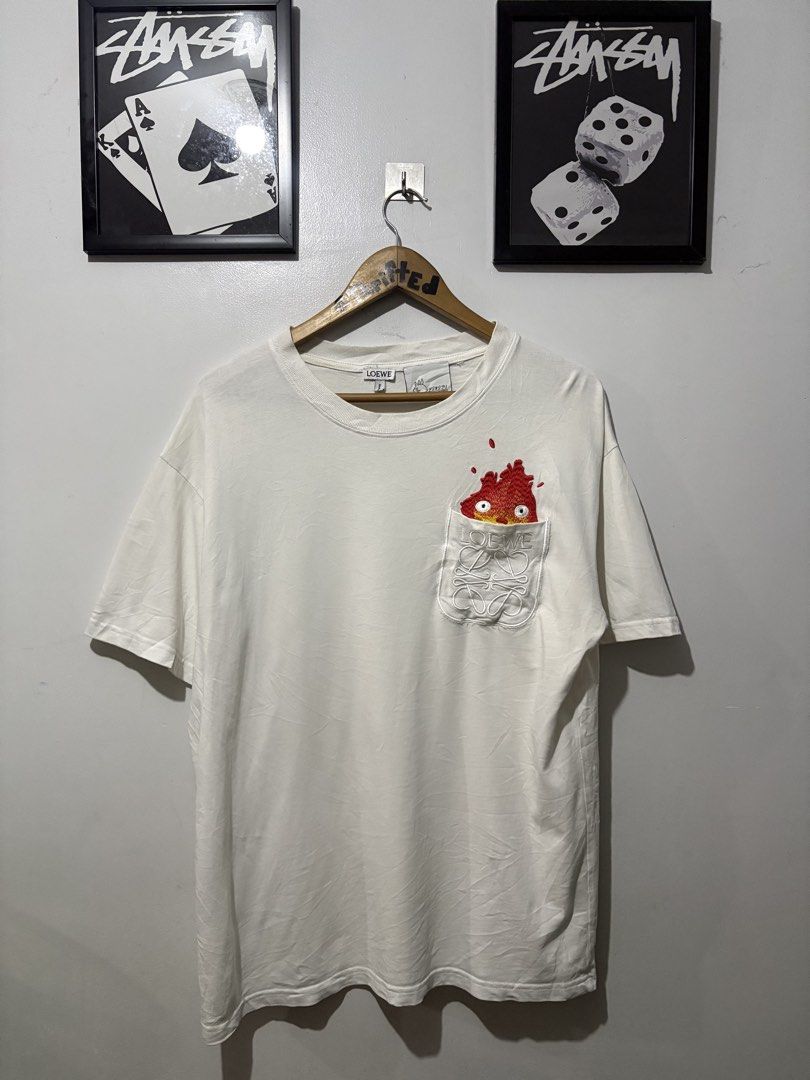 Loewe x Studio Ghibli Fire pocket tee (Category: Tshirts & Polo Shirts ) located in Makati City. Submitted by ThriftedGoods (Listing ID 1460858056, Image 1). Description: Feel free to ask for more detailed photos In excellent condition No issues Length-29 Width-23.