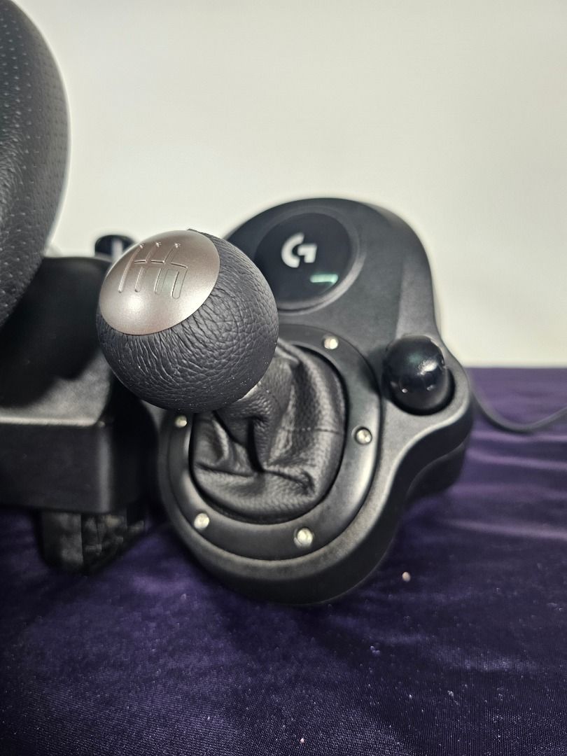 Logitech G29 + Pedals + Driving Force Shifter | Mint 9.5/10 (Category: PlayStation) located in Caloocan City. Submitted by elleandhermusings (Listing ID 1460828842, Image 2). Description: Logitech G29 Driving Force complete racing setup. Condition: 9.5/10 — mint / near-pristine Includes: G29 steering wheel 3-pedal set Logitech Driving Force 6-speed shifter Very clean and well maintained. Leather wheel and shifter show no significant wear, peeling
