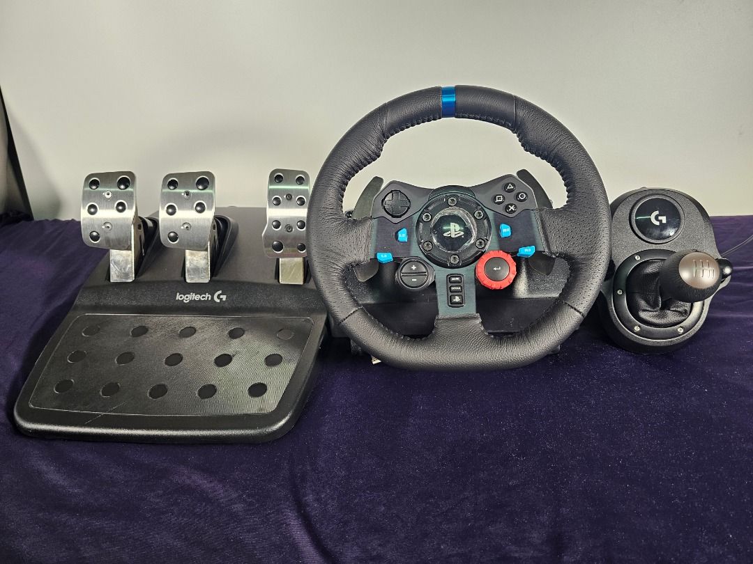 Logitech G29 + Pedals + Driving Force Shifter | Mint 9.5/10 (Category: PlayStation) located in Caloocan City. Submitted by elleandhermusings (Listing ID 1460828842, Image 1). Description: Logitech G29 Driving Force complete racing setup. Condition: 9.5/10 — mint / near-pristine Includes: G29 steering wheel 3-pedal set Logitech Driving Force 6-speed shifter Very clean and well maintained. Leather wheel and shifter show no significant wear, peeling