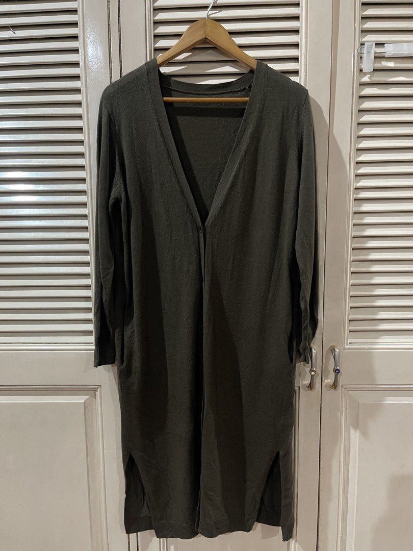 Long Olive Green Cardigan (Category: Coats, Jackets and Outerwear) located in Quezon City. Submitted by shopnkeep (Listing ID 1460828188, Image 1). Description: - freesize fits xs-large Mop: bpi gcash Shipping: c/o buyer loc qc Long olive green cardigan - V-neckline with single button closure - Long sleeves - Side slits at hem - Soft knit material - Ideal for layering.