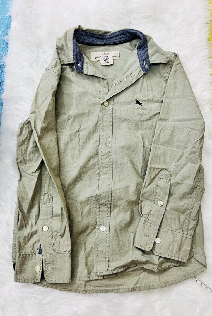 Long sleeves polo (Category: Babies & Kids Fashion) located in Mandaluyong City. Submitted by one.stopshop (Listing ID 1460761829, Image 1). Description: Preloved H & M polo 📏 Size: 6-7 YRS OLD 📐 Length: 18inches/ Width/ 26 inches 🎨 Color: sage green Preloved but still in very good condition. Please manage expectations as this is a preloved item, but I assure you it has been well cared for and remains in great condition. 💙 Note: Actual color 