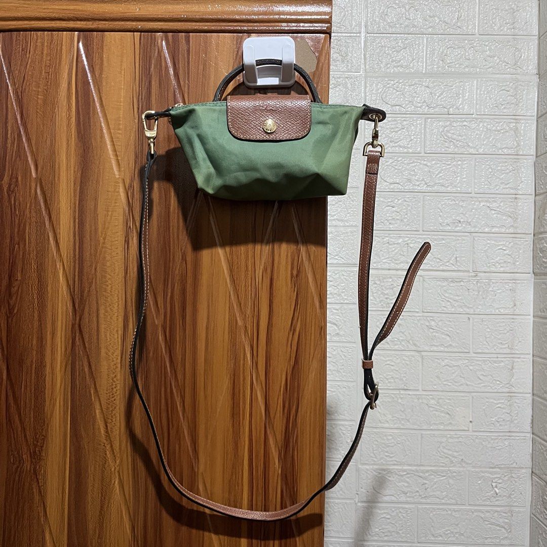 Longchamp Le Pliage Green Top Handle Bag with Strap (Category: Luxury Bags & Wallets) located in Carmen. Submitted by rr_thrifts (Listing ID 1460765360, Image 2). Description: - Green Longchamp Bag - Detachable Leather Strap Included - Elegant Gold Hardware Details - Premium Leather Trim and Handles - Versatile for Everyday Use - Can be Worn as Crossbody or Shoulder Bag.