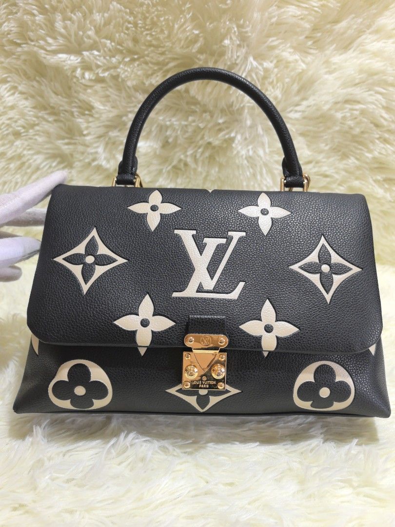 Louis Vuitton Capucines MM / BB in the Giant Monogram pattern (Category: Cross-body Bags) located in Manila. Submitted by curatedbygenz (Listing ID 1460897012, Image 2). Description: Black and cream monogram design Top handle with detachable strap Excellent condition Fits daily essentials.