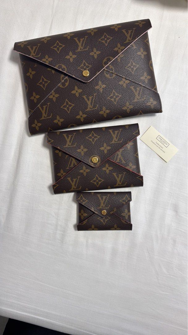 Louis Vuitton Monogram Envelope Pouch Set (Category: Luxury Bags & Wallets) located in Pasig City. Submitted by regden (Listing ID 1460879054, Image 1). Description: - Set of 3 Louis Vuitton monogram pouches - Includes large, medium, and small envelope styles - Classic LV monogram canvas - Gold button closure - Interior lining: Pink (large pouch), Red (medium & small pouches) - Ideal for organizing your essentials BARELY USED. Pristine condition.