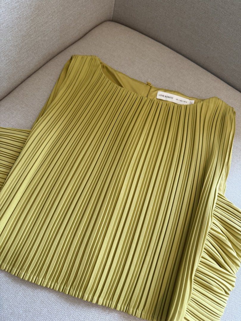 Love Bonito Pleated Sleeveless Top Size Small (Category: Sleeveless) located in Manila. Submitted by ella1222 (Listing ID 1460730847, Image 2). Description: - Olive green pleated top - Sleeveless design - Pairs well with skirts or pants - Comfortable and stylish - Suitable for any occasion, dress up or down.