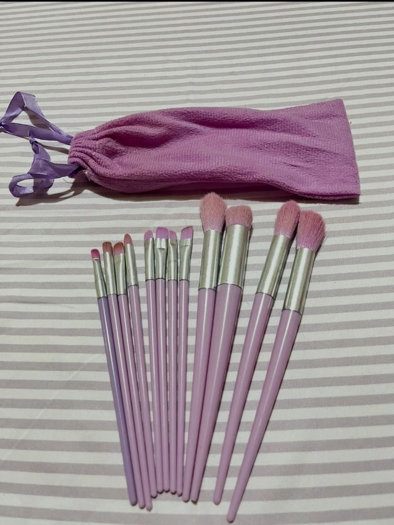 Lovito 12 Piece Makeup Brush Set with Pouch (Category: Makeup) located in Binan City. Submitted by med.ph7 (Listing ID 1460858403, Image 1). Description: - 12-piece makeup brush set - material: man-made fiber - Includes a soft purple drawstring pouch, perfect for travel - Features light purple handles and silver ferrules - Ideal for applying foundation, eyeshadow, and blush - Brushes are clean and well-maintained.