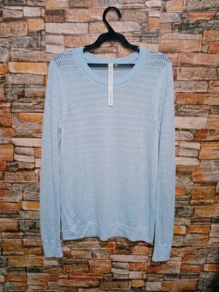 Lululemon breeze by Long sleeve (dot 8) (Category: Activewear) located in Arayat. Submitted by keenwolf-a7b5 (Listing ID 1460915267, Image 2). Description: - Light blue Lululemon long sleeve top - dot 8 - Features a perforated pattern for enhanced breathability - Classic crew neck design - Versatile for workouts or everyday casual wear - Lightweight and comfortable fabric.