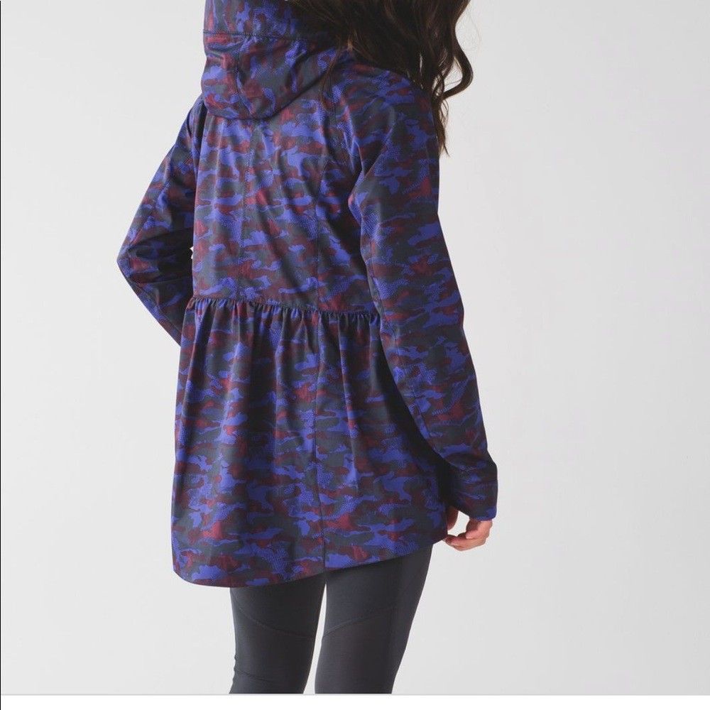 Lululemon Rain For Daze Jacket II (Category: Coats, Jackets and Outerwear) located in Manila. Submitted by pdwainn84681 (Listing ID 1460490553, Image 2). Description: - Lululemon lightweight hooded jacket - Cool camouflage print in blue, red, and green tones - Features zippered pockets on the front - Elasticated waist detail for a comfortable fit - Ideal for layering or protection against light rain - Made in Vietnam.
