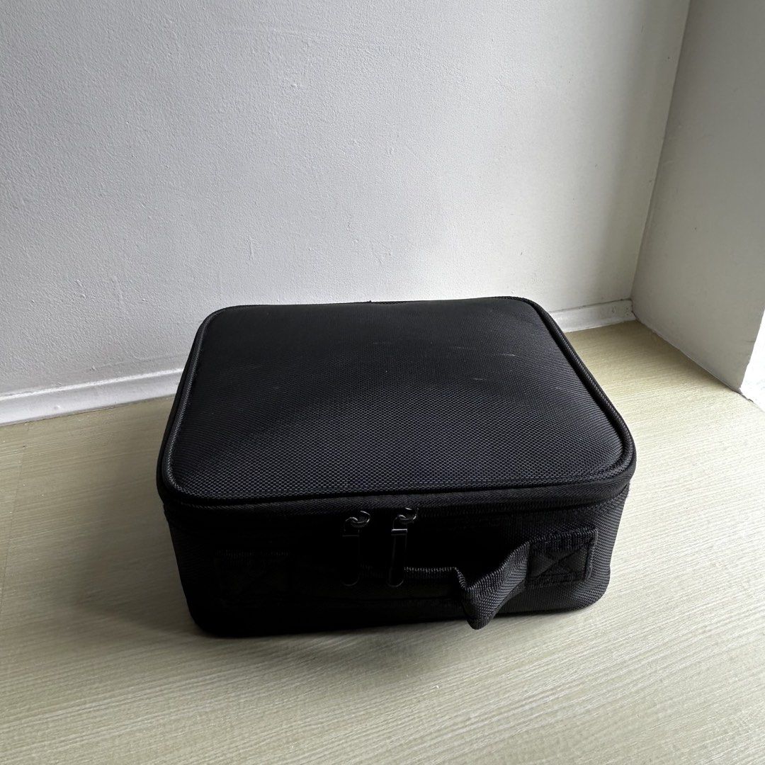 MAKEUP ORGANIZER (Category: Makeup) located in Manila. Submitted by thechicacueva (Listing ID 1460761972, Image 1). Description: sleek black makeup case zippered compartment inside lid for brushes/small items main compartment with adjustable dividers for organization convenient side handle for easy carrying ideal for travel or home storage minor issue: makeups stains that are prolly washable.
