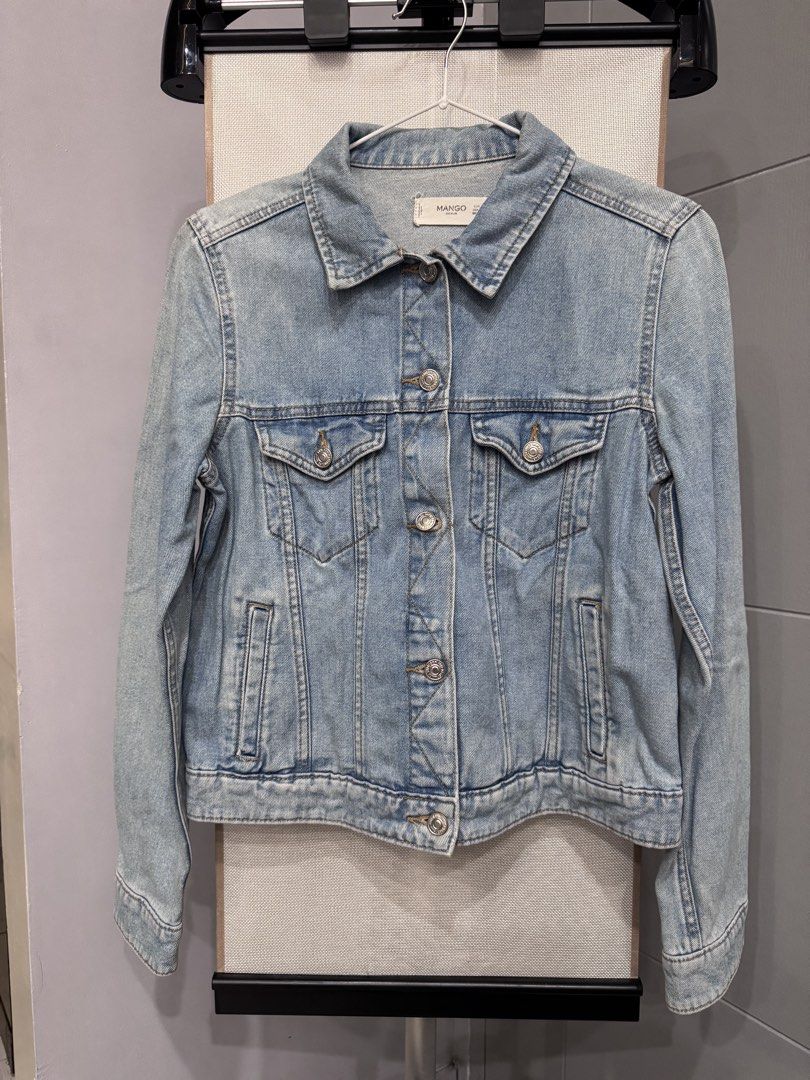 Mango Light Wash Denim Jacket (Category: Coats, Jackets and Outerwear) located in Manila. Submitted by altabl123 (Listing ID 1460855531, Image 1). Description: - Classic light wash denim jacket from Mango - Button-up front closure - Two functional chest pockets - Standard shirt collar - Versatile for layering over tees or dresses - Easy to style for any outfit.