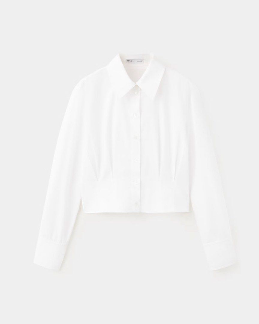 MANGO White Cropped Button-Up Shirt (BNWT) (Category: Shirts) located in Quezon City. Submitted by glrysbll (Listing ID 1460797709, Image 1). Description: White MNG cropped shirt (Gaby) - button-up with collar - long sleeves with cuffs - fitted waist with pleating detail (darts at the back also) - great for work or business casual with jeans still with tags, bought for Php1995 rfs. impulse buy after a stressful day lawlz i dont like the way it fi
