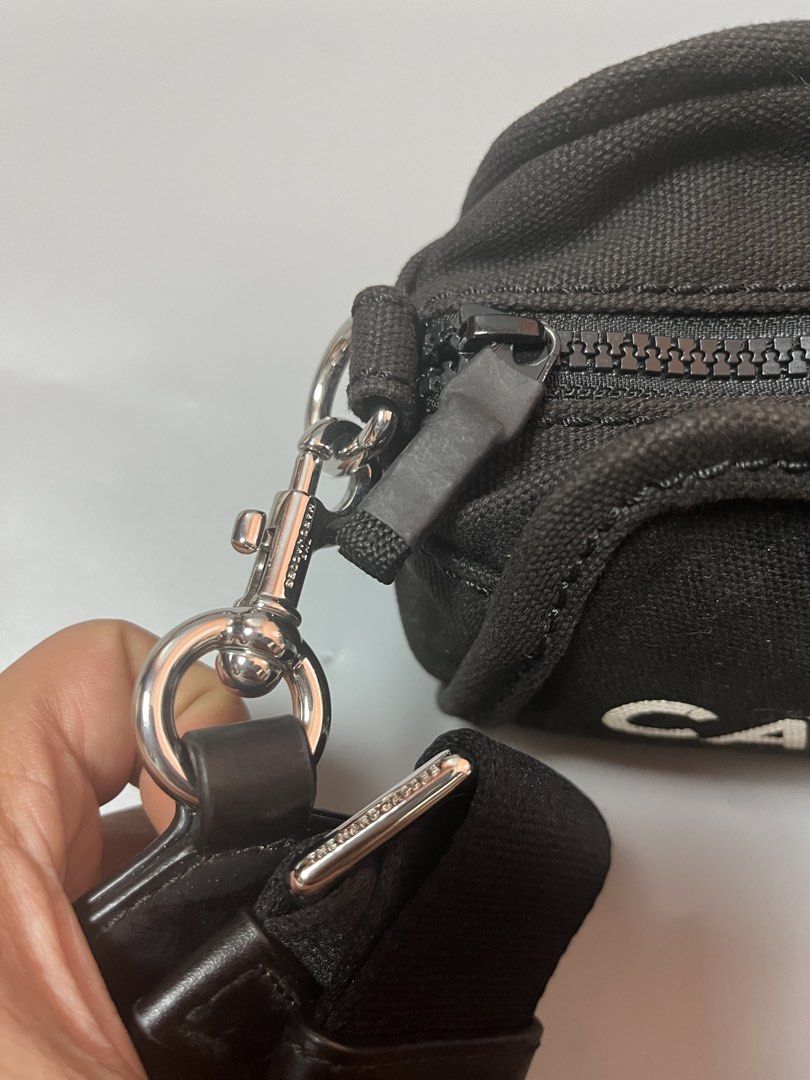 Marc Jacob “ the camera bag” canvas slingbag (Category: Sling Bags) located in Quezon City. Submitted by theideal (Listing ID 1460899135, Image 3). Description: Read first before buy Legit/Authentic Marc Jacob “the camera bag” canvas slingbag No box Excellent condition No flaws See picture details posted.