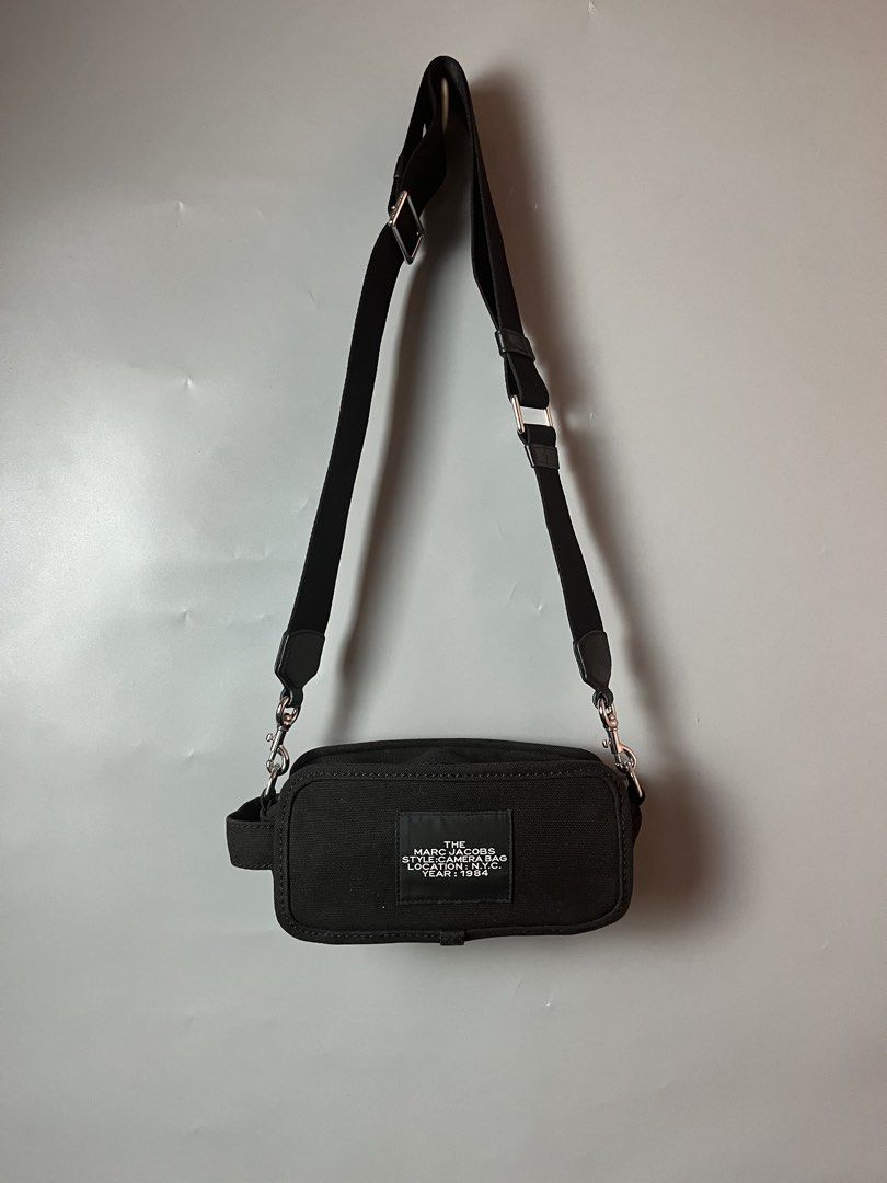 Marc Jacob “ the camera bag” canvas slingbag (Category: Sling Bags) located in Quezon City. Submitted by theideal (Listing ID 1460899135, Image 2). Description: Read first before buy Legit/Authentic Marc Jacob “the camera bag” canvas slingbag No box Excellent condition No flaws See picture details posted.